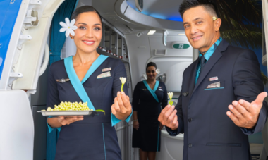 Flight attendant welcoming passengers
