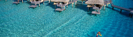 Intercontinental Bora Bora Le Moana Resort Couple paddling